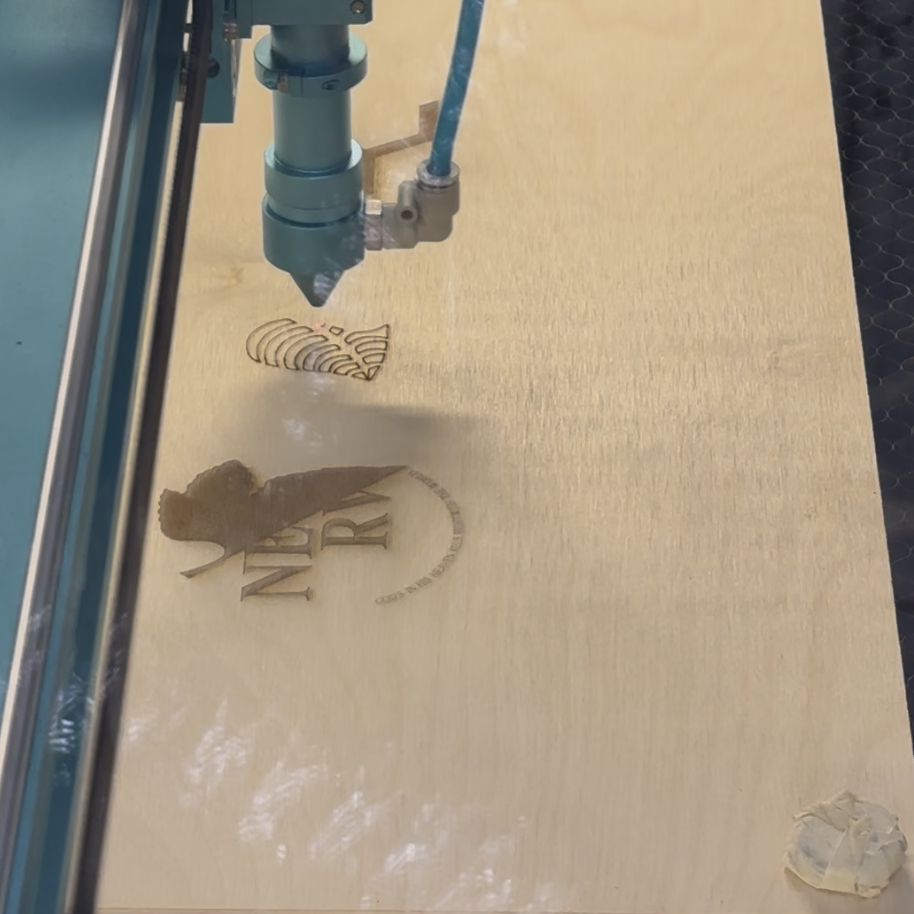 Started laser cutting. I was so excited and I was surprised that the laser cutting machine could cut such fine lines. And the machine cut in a different order than we thought, we thought it would cut one person's cell phone holder and then go on to the next person's cell phone holder, but it actually worked in the order of engrave to score to cut.